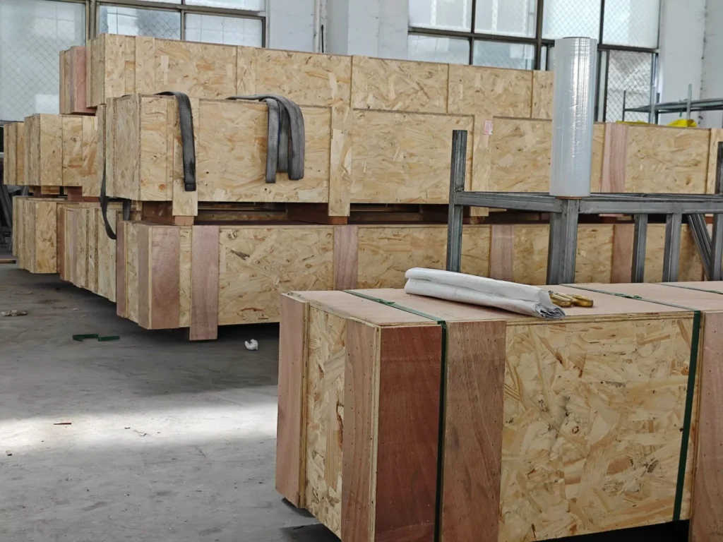 Reinforced plywood crate containing individually sleeved titanium tubes with end caps for safe global shipping.