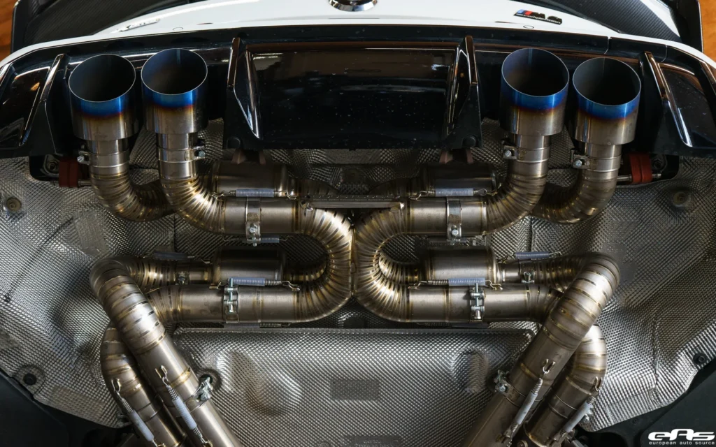 The Engineer’s Guide: What Are the Real Benefits of a Titanium Exhaust System? 1 High-performance custom titanium exhaust system installed on a track car.