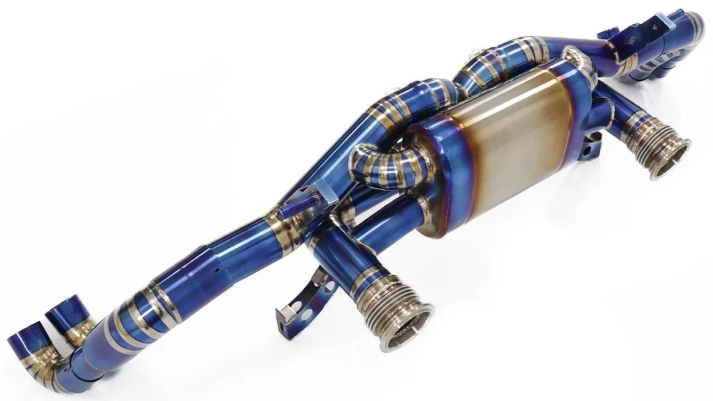 The Engineer’s Guide: What Are the Real Benefits of a Titanium Exhaust System? 2 Comparing titanium vs stainless steel exhaust weight showing a 50 percent mass reduction.