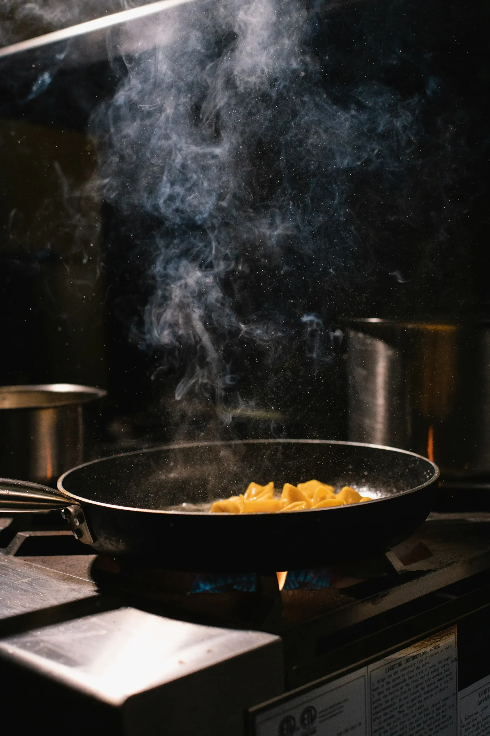 Are Titanium Pans Safe? What I Found After Testing Both Types 1 Black frying pan on a kitchen stovetop - pure titanium skillet cooking surface
