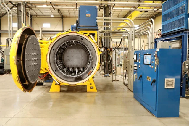 Titanium Heat Treatment: Annealing Temperatures, STA, and Stress Relief by Grade 1 Industrial vacuum furnace used for aerospace titanium heat treatment - controlled atmosphere furnace interior with titanium components