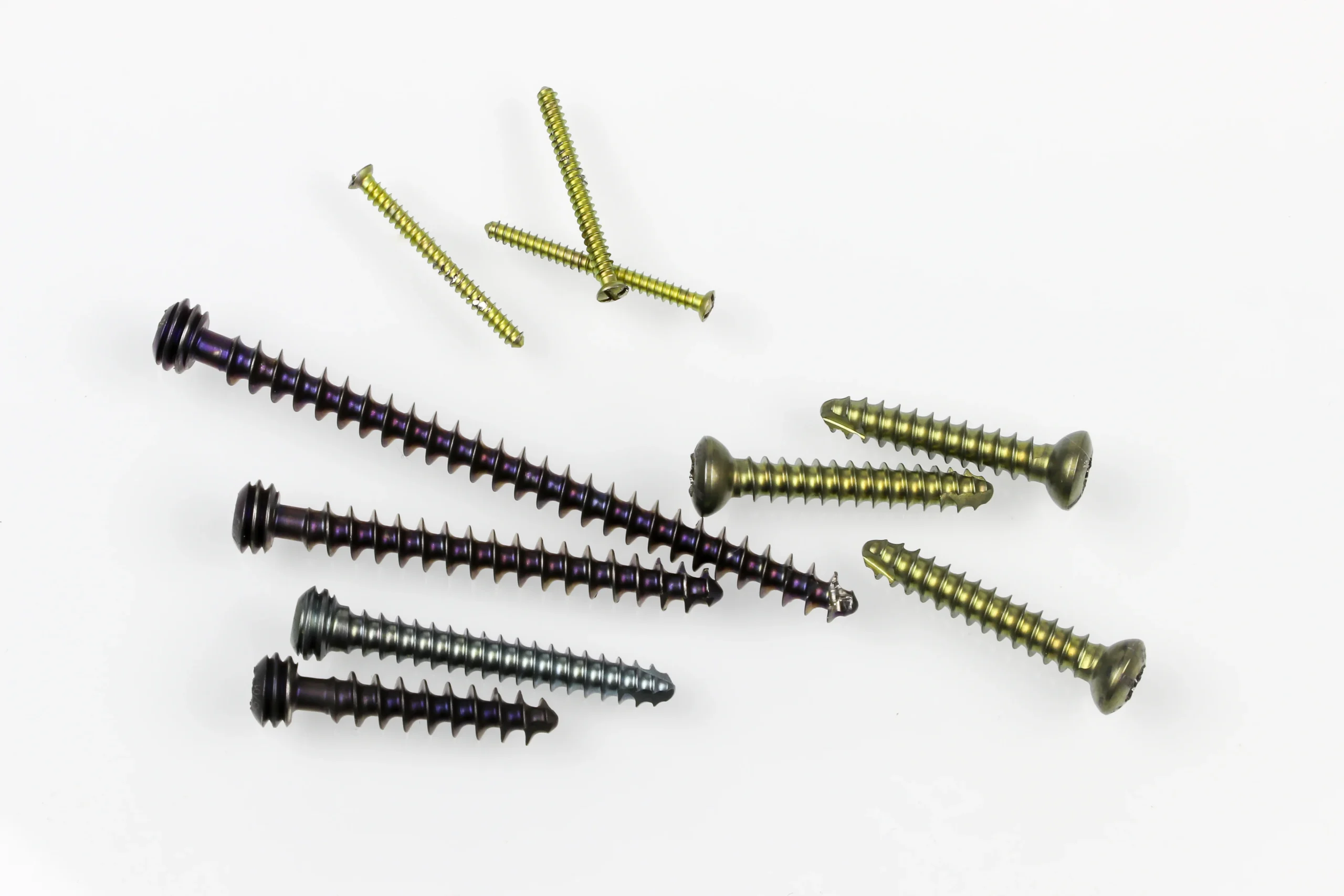 Titanium Passivation: Process Guide, ASTM Standards, and Acid Selection 4 Machined titanium orthopedic implant components including hip stem and screws made from Ti-6Al-4V ELI Grade 23 alloy ready for passivation