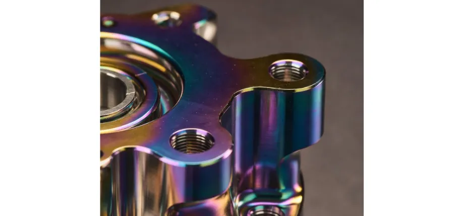 How to Polish Titanium to a Mirror Finish: Grit Sequence, Compounds, and Common Mistakes 2 Titanium surface showing rainbow TiO2 heat discoloration - blue purple interference colors from oxidation